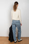 The 90'S Jeans by Agolde in color streamline is a relaxed mid rise straight leg jeans in a distressed mid blue wash