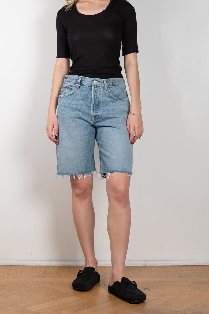 The Ira Short Waist by Agolde in color Misunderstood has a a mid-rise loose fit, longer inseam and 90's connotations in a medium blue wash
