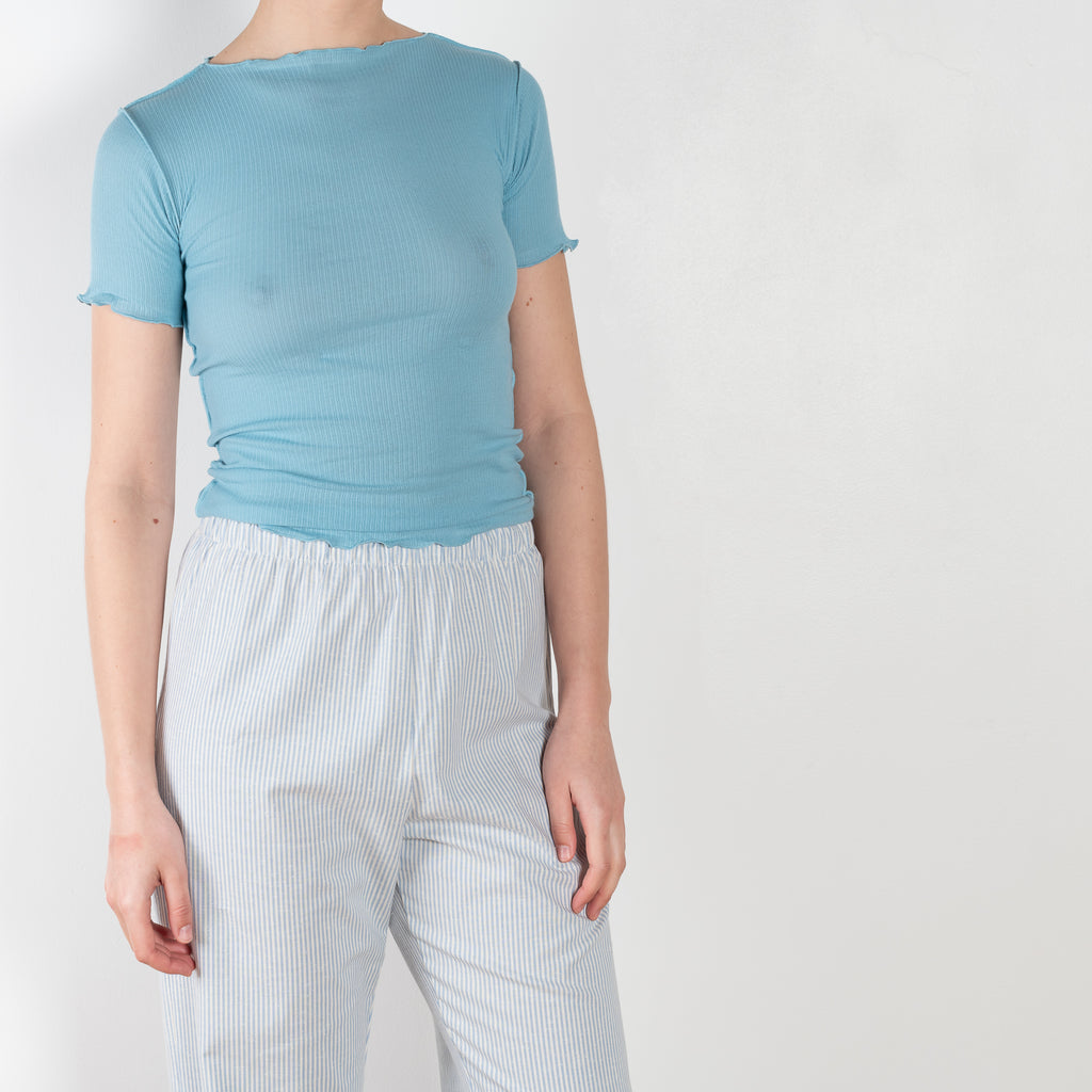 The Ole Pants by Baserange are high waisted loose trousers in blue striped organic cotton
