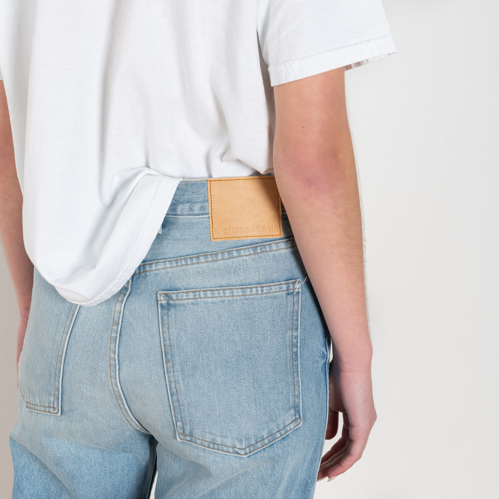 The Plein Relaxed Straight jeans by B SIDES  is a high waisted jeans with a relaxed straight leg in a light blue wash