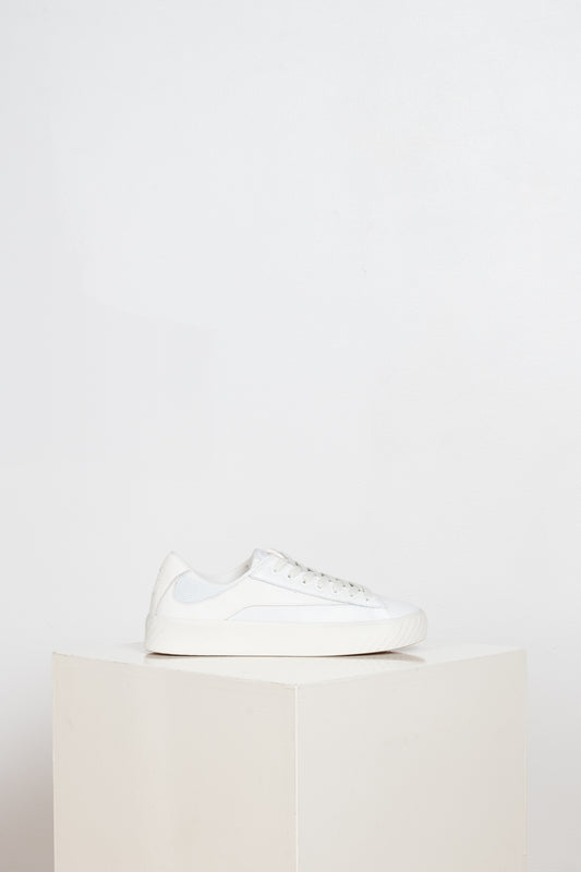 The Rodina Sneakers from By Far are comfy sneakers with a mesh and leather upper and a white tonal grained leather flash decorative detail
