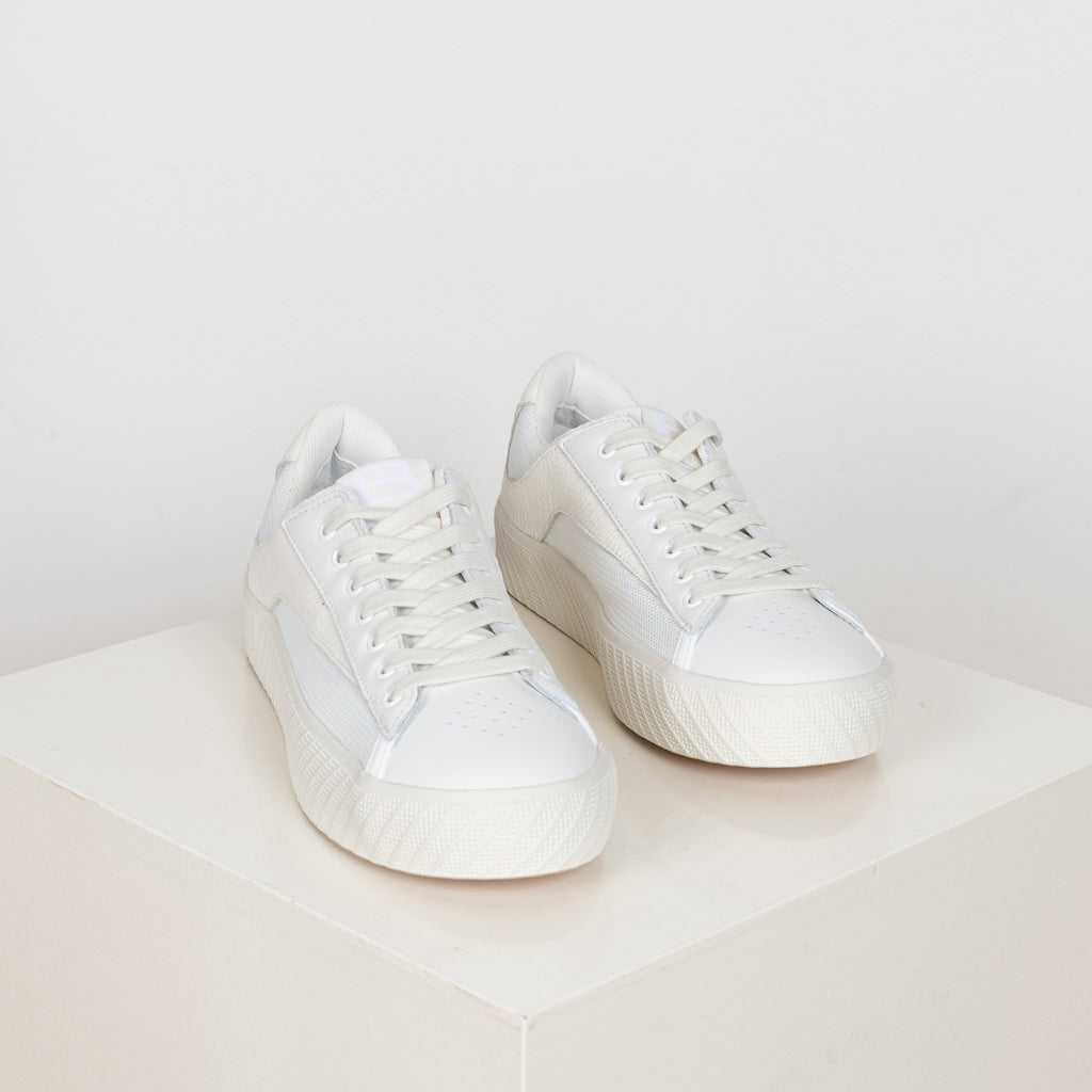 The Rodina Sneakers from By Far are comfy sneakers with a mesh and leather upper and a white tonal grained leather flash decorative detail