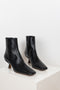The Lange Boots by By Far in black snake print