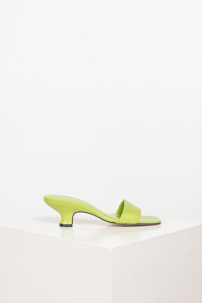 The Freddy Mules by By Far are squared toe mules in a soft and supple leather with a 5 cm curved heel