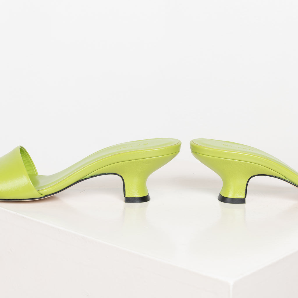 The Freddy Mules by By Far are squared toe mules in a soft and supple leather with a 5 cm curved heel