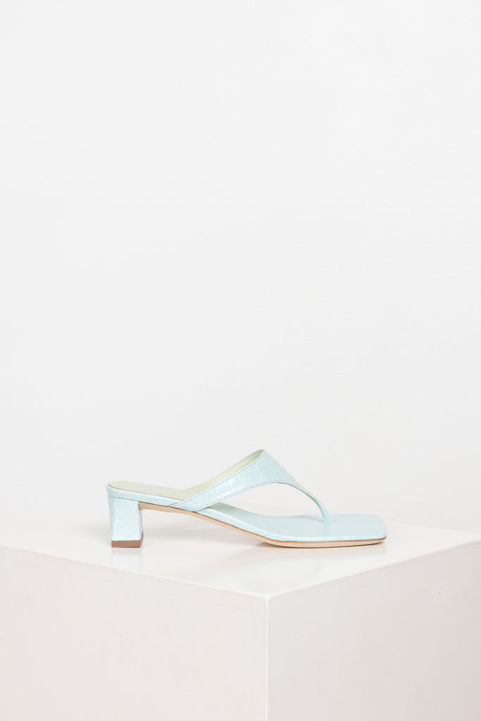 The Shawn Mules by By Far are squared toe flip-flop mules with a sturdy 4 cm block heel