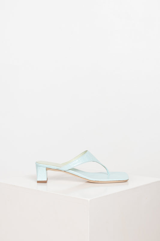 The Shawn Mules by By Far are squared toe flip-flop mules with a sturdy 4 cm block heel