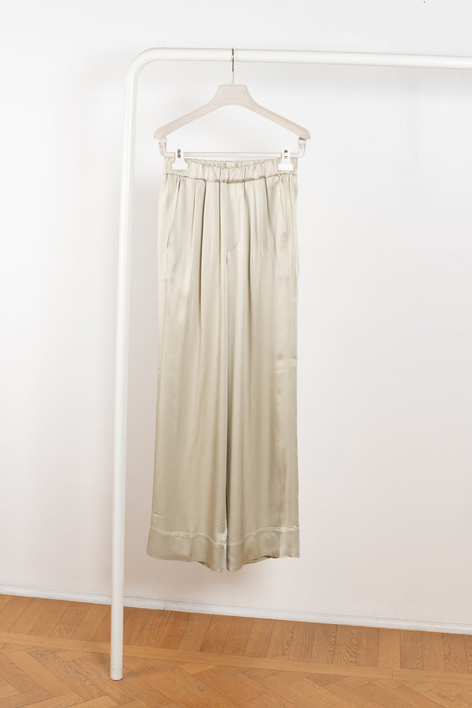 The Satin Trouser 0320 by GAUCHERE is a high waisted trouser with a wide leg and front pleats in a fluid satin 