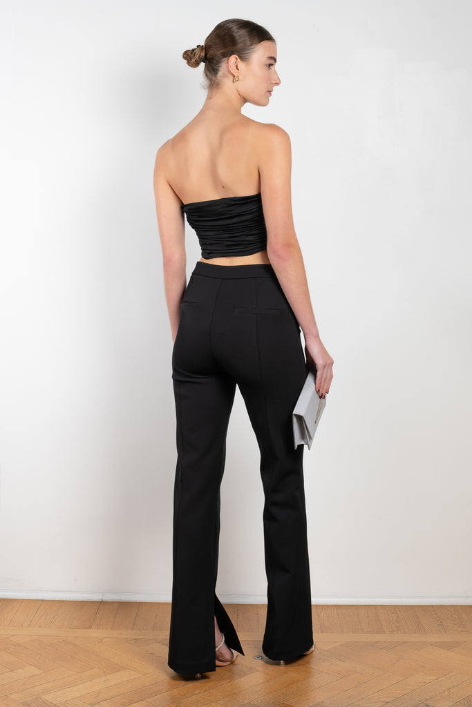 The Afega Pants by GAUGE81 are high waisted spandex trousers with a wrap accent that accentuates the waist and elevates any look