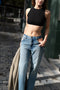 The Cut-out Jeans by Gauchere is a signature denim with a relaxed fit and a cut-out detail at the hips