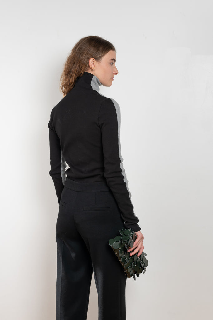 The Two Tone Top by Gauchere is a turtleneck top with a long slim fit in ribbed two tone cotton