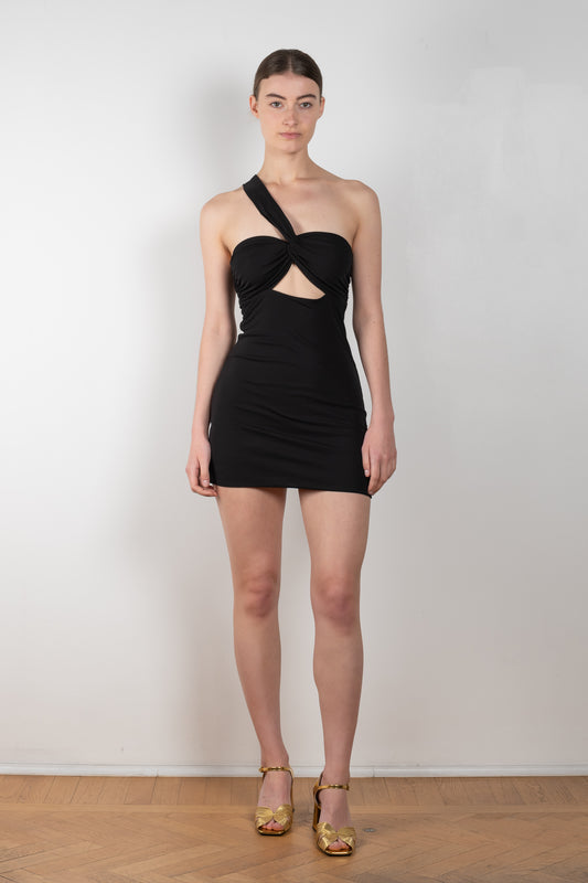 The Jinan Dress by Gauge81 is a fitted mini dress with a cross-over on the chest and a Gauge signature cut-outs in the front