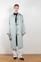 The Rubber Coat by Kassl Editions is a below the knee length rain coat in a soft and fluid rubber fabric
