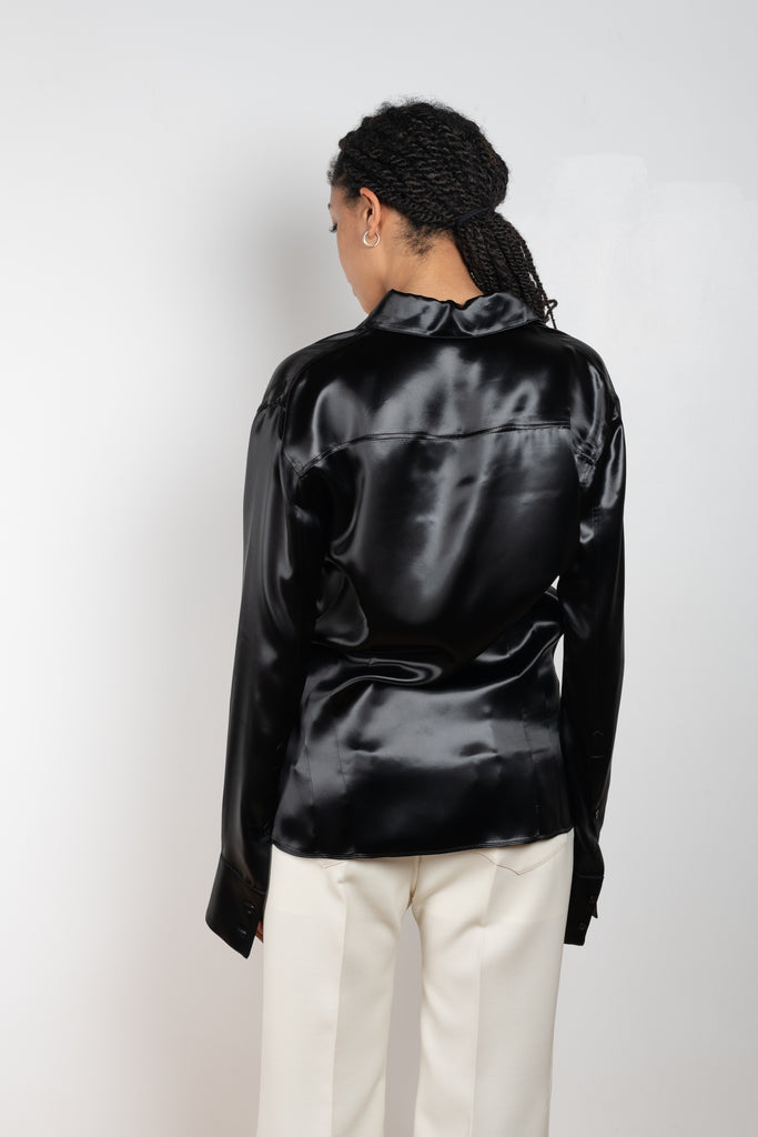 The Satin Shirt by Kwaidan Editions is a fitted buttoned shirt with extra long sleeves in a black satin