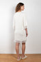 The Cella Dress by Loulou Studio is a fringed dress with albow length sleeves in a soft silk and viscose blend