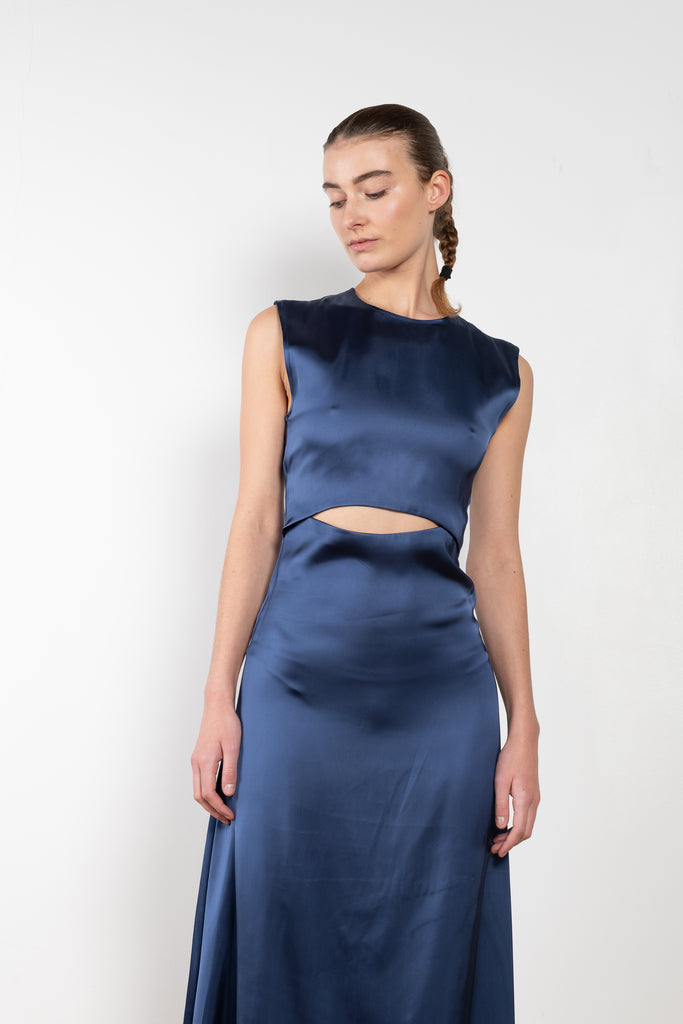 The Copan Cut Out Dress by Loulou Studio is a long dress with  a front cut-out detail in a fluid satin