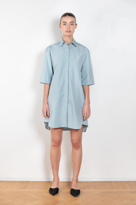 The Evora Dress  by Loulou Studio is a short sleeved shirtdress in a crisp cotton with generous volumes
