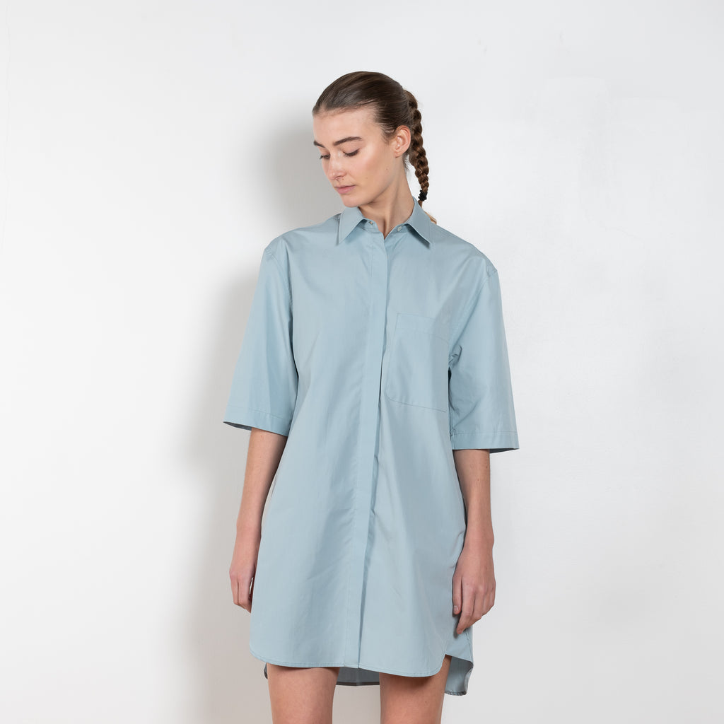 The Evora Dress  by Loulou Studio is a short sleeved shirtdress in a crisp cotton with generous volumes