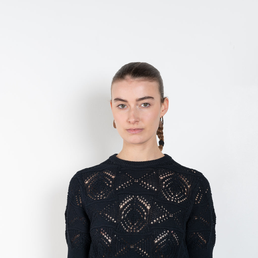 The Jaro Top by Loulou Studio is a cropped cotton crochet top with short sleeves