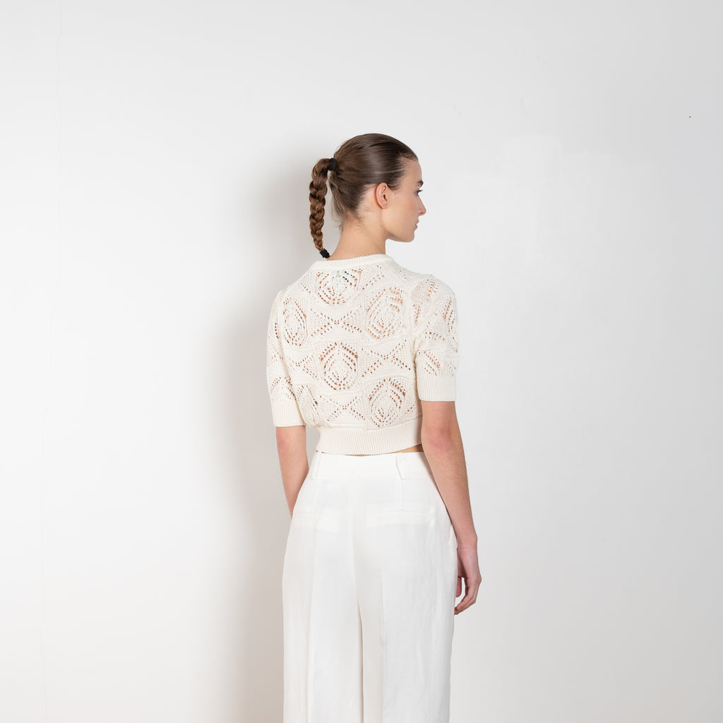 The Jaro Top by Loulou Studio is a cropped cotton crochet top with short sleeves