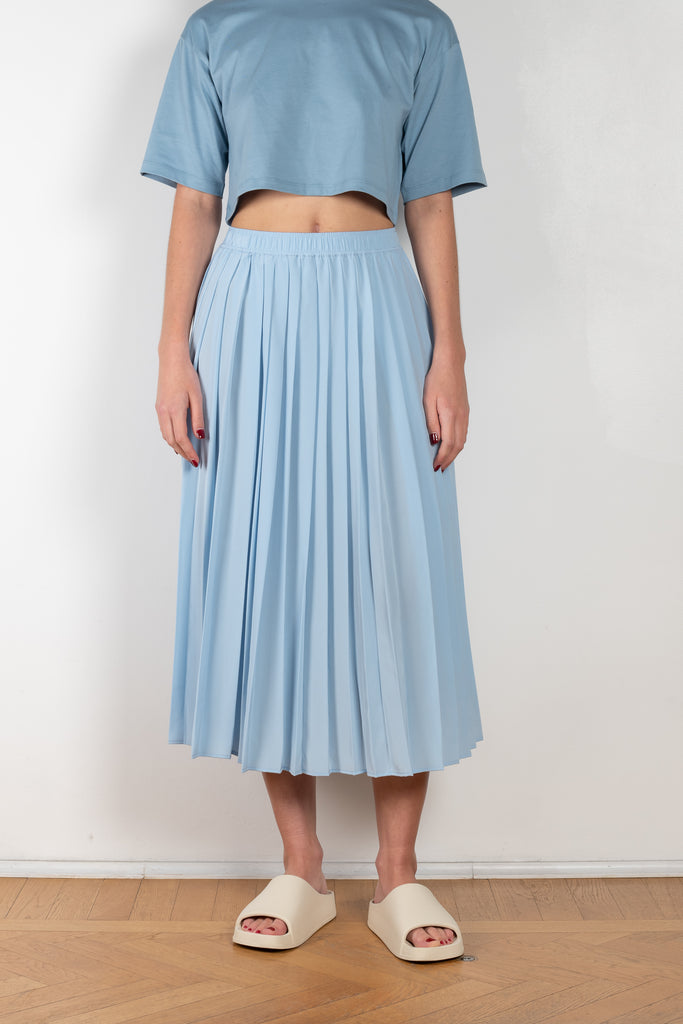 The Nanao Skirt by Loulou Studio is a high waisted pleated midi skirt in a pale blue silk crepe