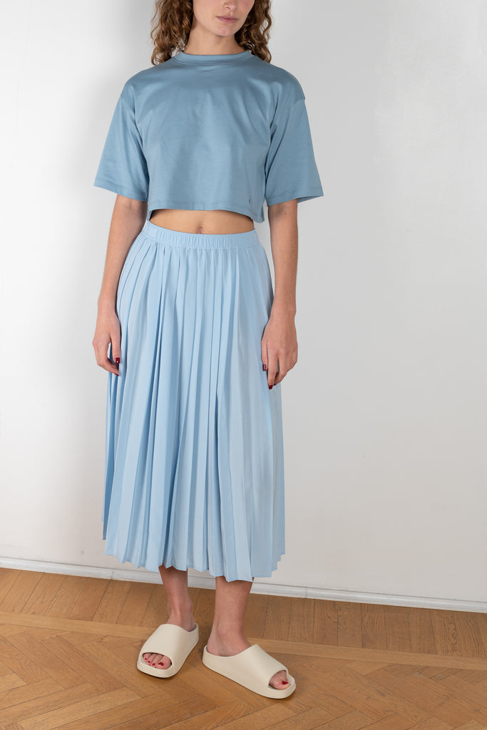 The Nanao Skirt by Loulou Studio is a high waisted pleated midi skirt in a pale blue silk crepe