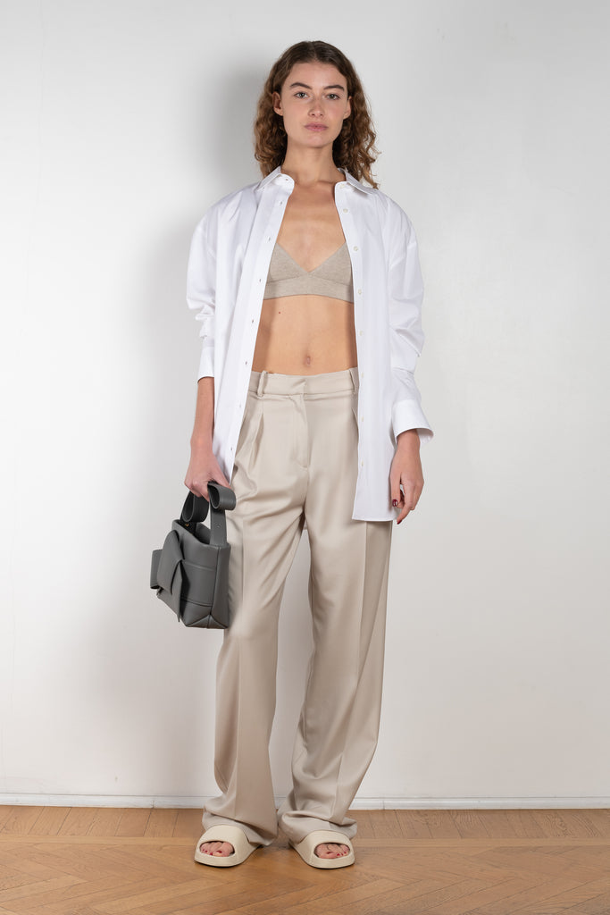 The New Sbiru Pants by Loulou Studio are signature suiting paints that sit on the waist, are ample and pleated at the waist