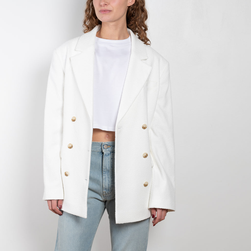 The Sara Blazer by Loulou Studio is a suiting blazer with a generous yet structured fit in a summer cotton bouclé