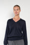 The Emilia Sweater is a fine knit cashmere sweater with a feminine v-neck