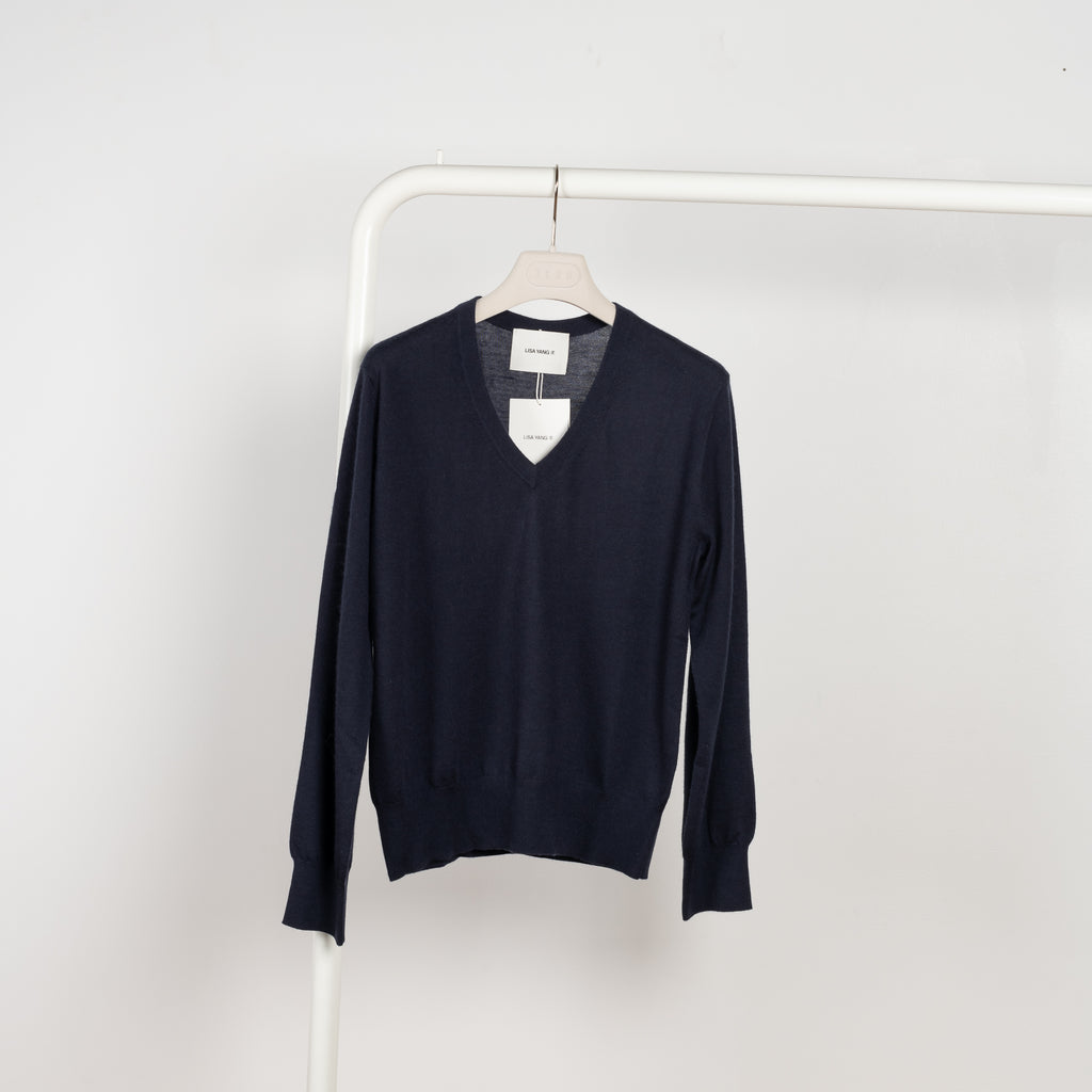 The Emilia Sweater is a fine knit cashmere sweater with a feminine v-neck