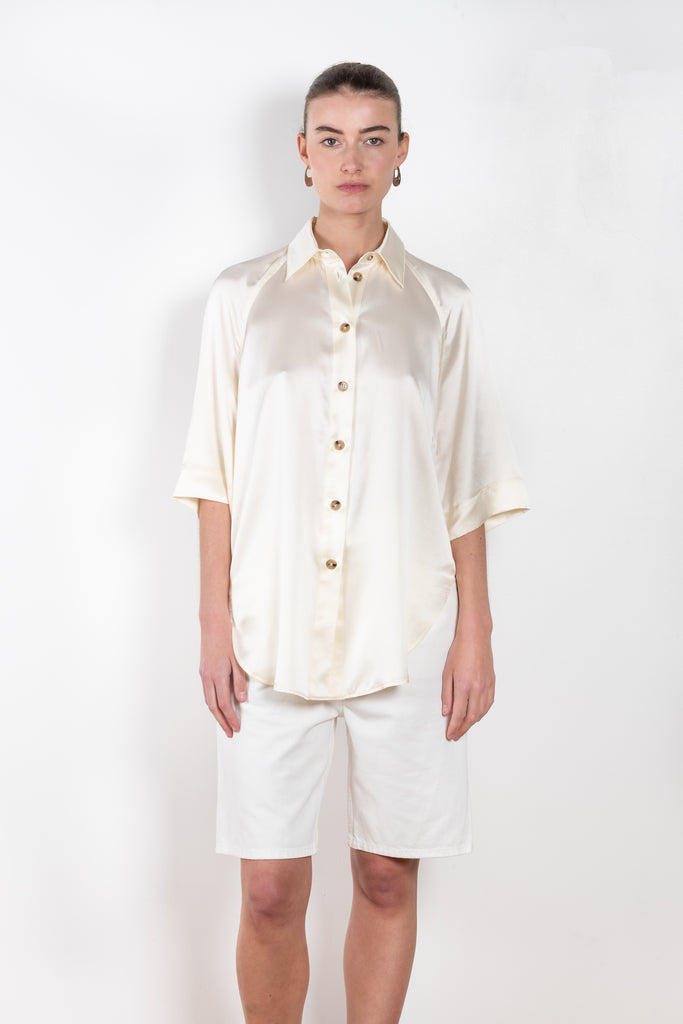 The Datia Shirt by Loulou Studio is an oversized shirt with rounded hems in a fluid silk satin 