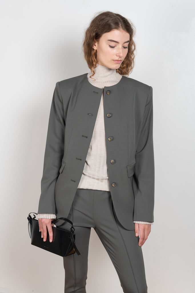 The Lattore Blazer by Loulou Studio is a fitted single breasted wool blazer with a centered waistline without collar
