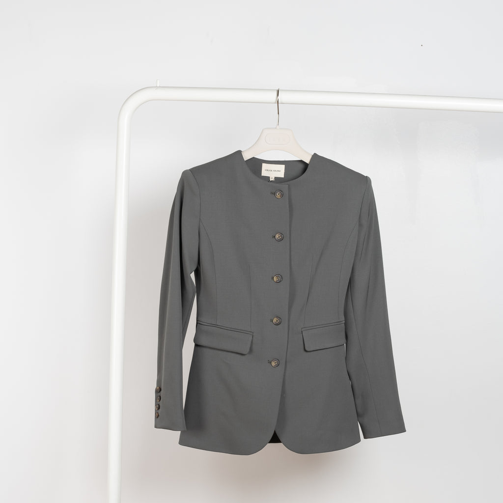 The Lattore Blazer by Loulou Studio is a fitted single breasted wool blazer with a centered waistline without collar