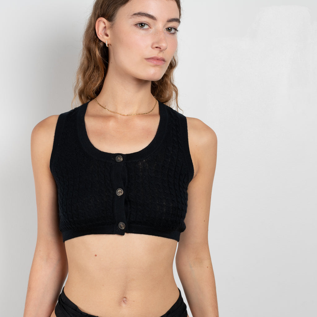 The Naga Bralette by Loulou Studio is a lightweight knitted bralette in a cashmere and wool blend cable knit with front buttoning