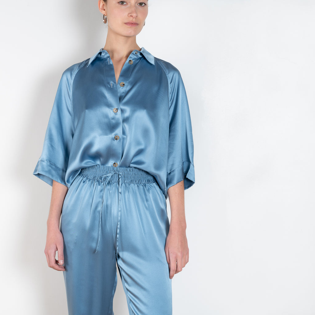The Soma Pants by Loulou Studio are silk satin trousers with an elasticated waistband and a relaxed fit