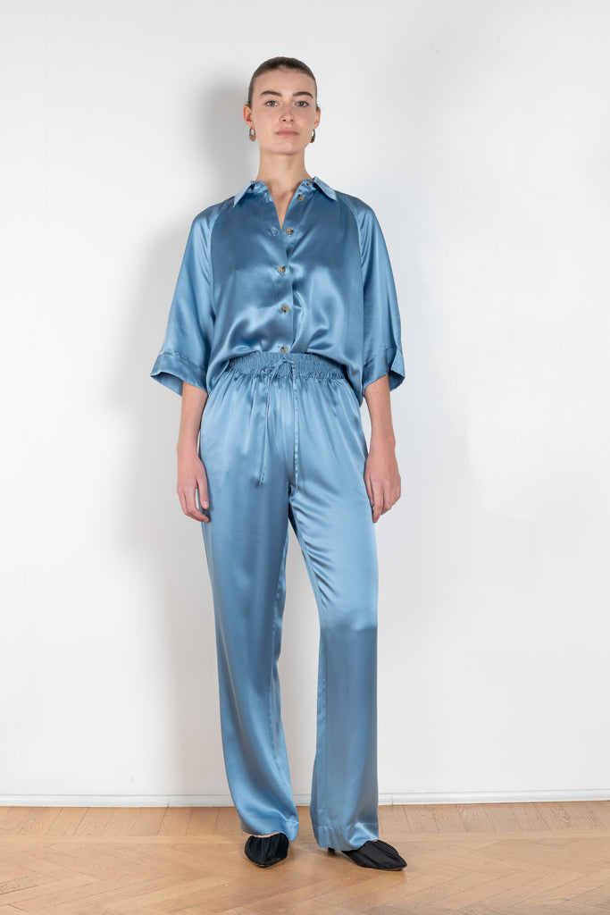 The Soma Pants by Loulou Studio are silk satin trousers with an elasticated waistband and a relaxed fit
