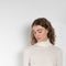 The Gallinara Turtleneck Tee by Loulou Studio is a fine ribbed turtleneck top in a soft wool blend 