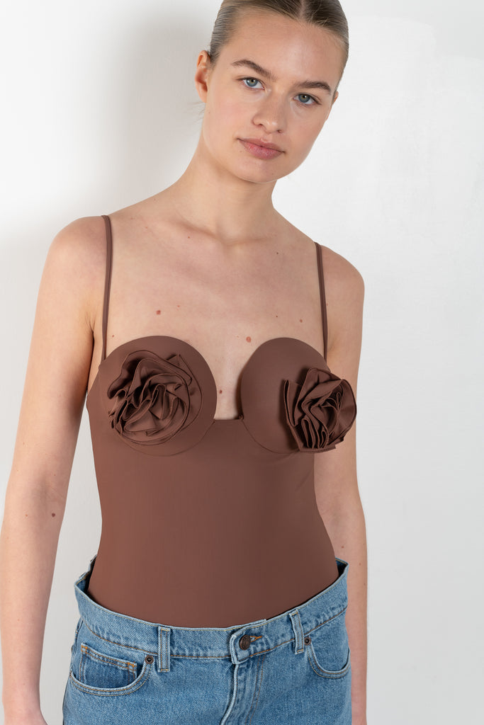 The Retro Bustier Swimsuit 01 by MAGDA BUTRYM is a retro one-piece swimsuit with a flower on each cup