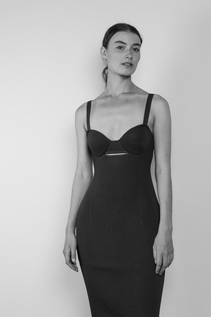 The Bustier Knit Dress 09 is a ribbed bustier tank dress with a close to the body fit for a feminine silhouette