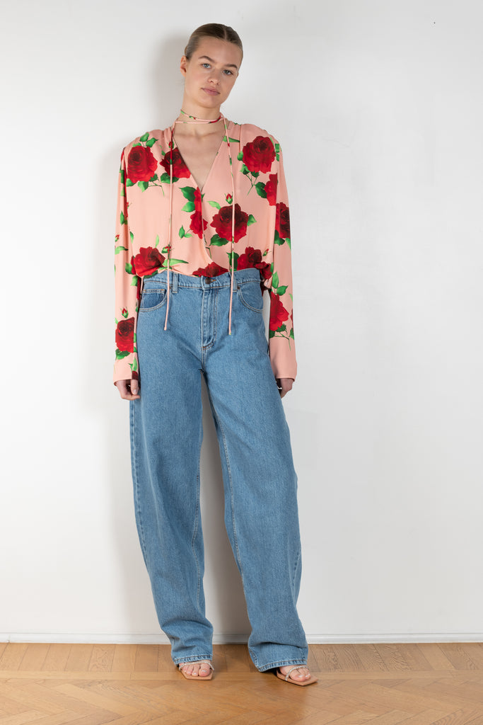 The Flower Blouse 04 is a signature flower printed blouse with a  moderate v neckline and a detachable oversized flower accent on the shoulderThe Flower Blouse 04 is a signature flower printed blouse with a  moderate v neckline and a detachable oversized flower accent on the shoulder