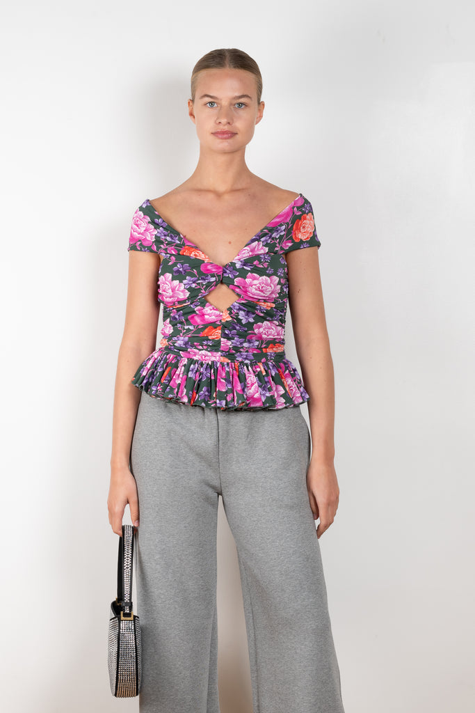 The Floral Peplum Top 02 by Magda Butrym is a floral off-the-shoulder top with a keyhole cutout opening at chest and a peplum detail