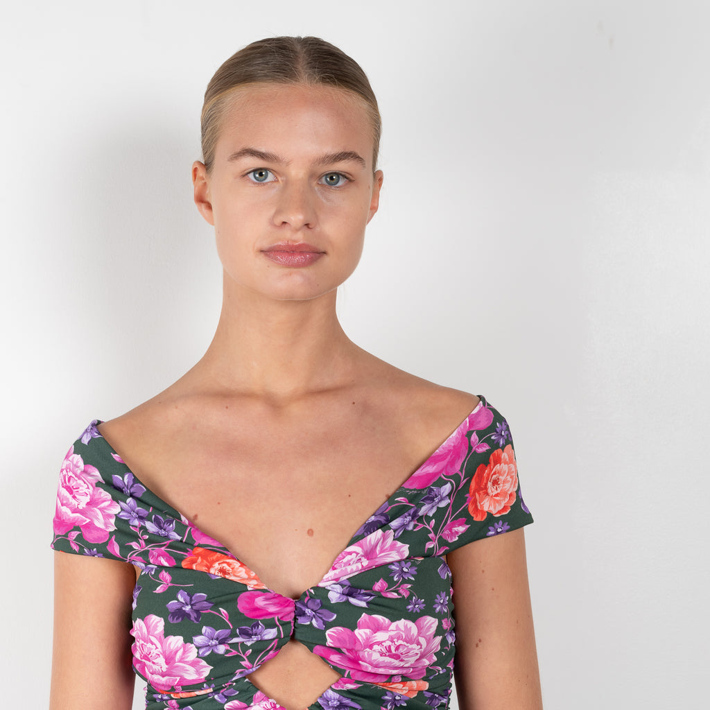 The Floral Peplum Top 02 by Magda Butrym is a floral off-the-shoulder top with a keyhole cutout opening at chest and a peplum detail