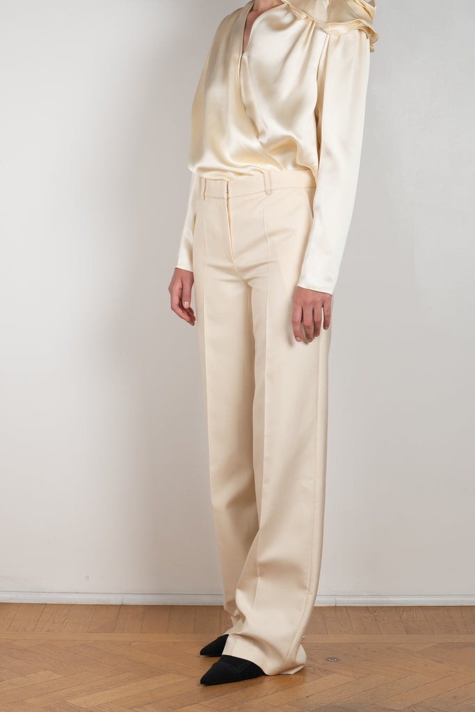 The Wide Leg Pants 08 by Magda Butrum are silk pants tailored with pleating, side pockets, belt loops, and a zip closure