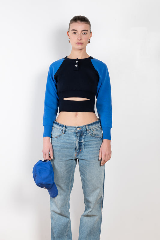 The Baseball Knit by Meryll Rogge is a fitted cropped sweater with a cut-out and baseball details