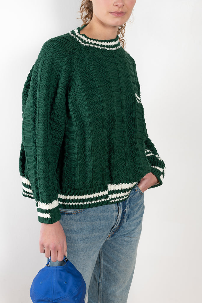 The Crewneck Sweater by Meryll Rogge is a loose sweater with asymmetrical sleeves and details