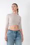 The Cropped Sweater by Meryll Rogge is a cropped cashmere sweater with signature MR details and a buttoned back