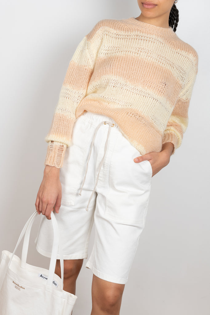 The Hadi Bermuda by Nanushka is a high waisted denim bermuda with vegan leather patch pockets on the back 