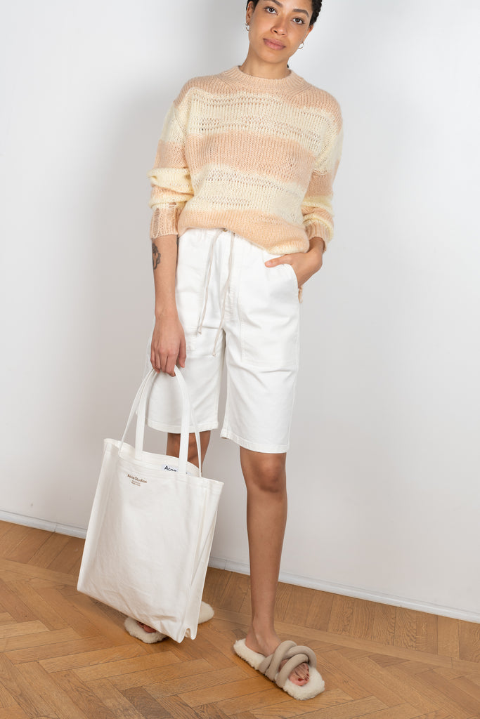 The Hadi Bermuda by Nanushka is a high waisted denim bermuda with vegan leather patch pockets on the back 