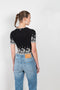 The Embroidered Top by Paco Rabanne is a lightweight nylon top with contrasted floral embroidery