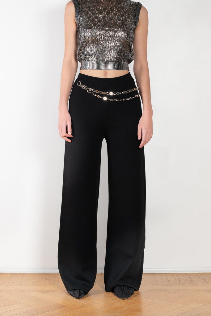 The Knit Chain Pants by Paco Rabanne is a signature knitted trouser with a straight leg and integrated chain belt